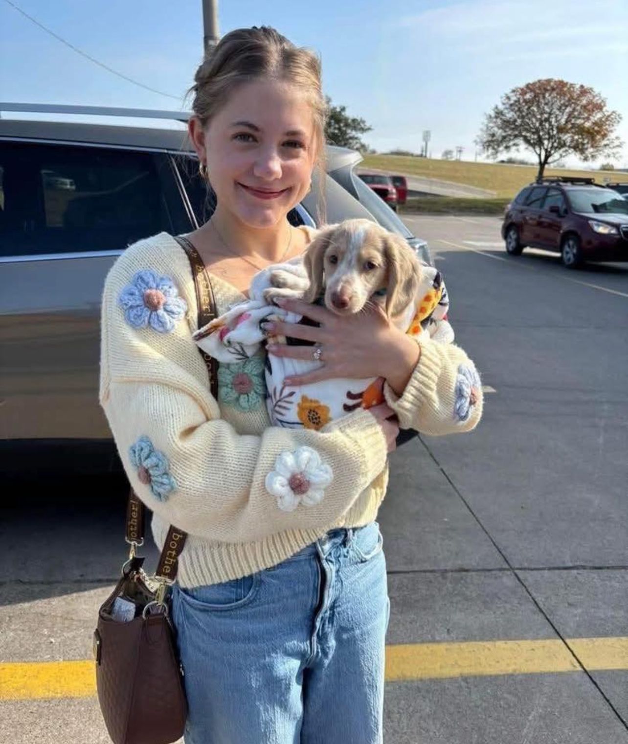 Olivia Bennett with their Evermora Home Dachshund